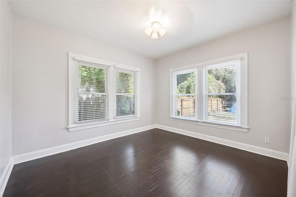 352 Cambridge Boulevard Winter Park, FL 32789 - Photo 14 of 35 an empty room with wooden floor and windows