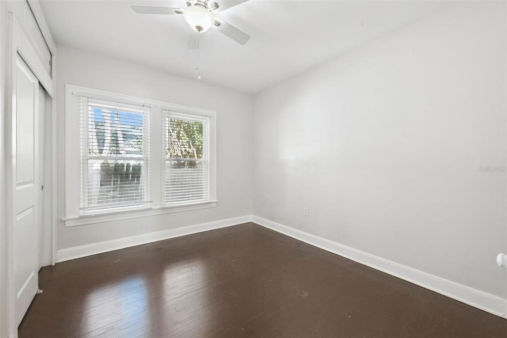 352 Cambridge Boulevard Winter Park, FL 32789 - Photo 18 of 35 an empty room with wooden floor and windows
