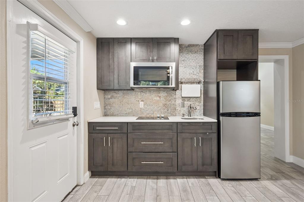 352 Cambridge Boulevard Winter Park, FL 32789 - Photo 23 of 35 a kitchen with a refrigerator and a sink