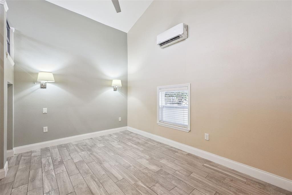 352 Cambridge Boulevard Winter Park, FL 32789 - Photo 26 of 35 an empty room with wooden floor and windows