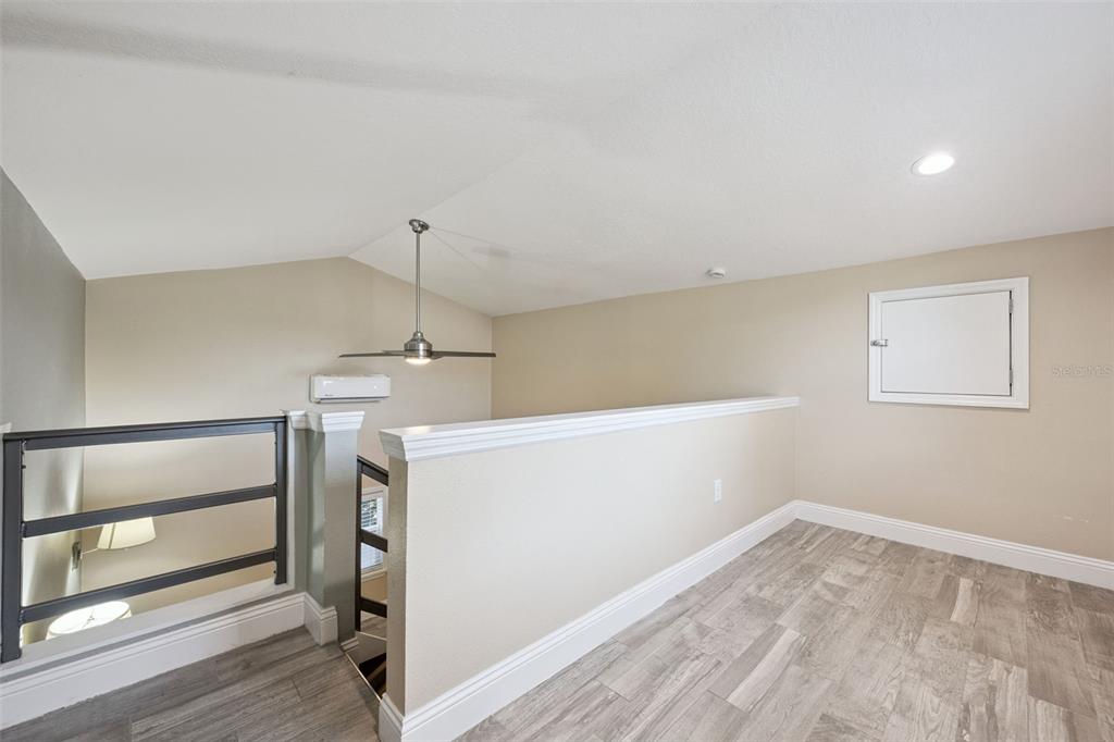 352 Cambridge Boulevard Winter Park, FL 32789 - Photo 30 of 35 a view of a room with wooden floor and white walls