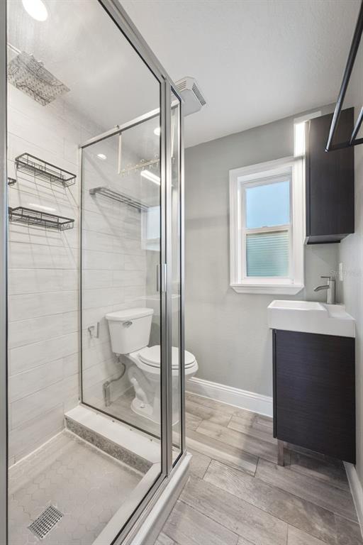 352 Cambridge Boulevard Winter Park, FL 32789 - Photo 31 of 35 a bathroom with a shower sink and mirror