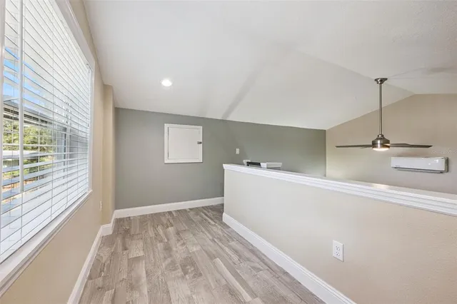 a bathroom with a shower sink and mirror