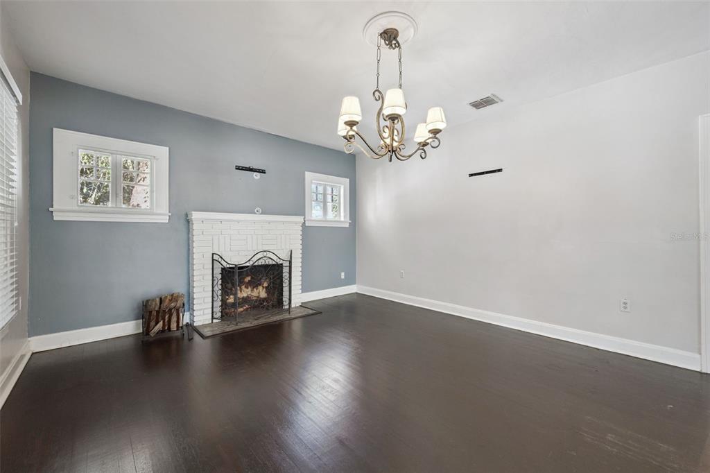 352 Cambridge Boulevard Winter Park, FL 32789 - Photo 5 of 35 a view of a livingroom with wooden floor a fireplace