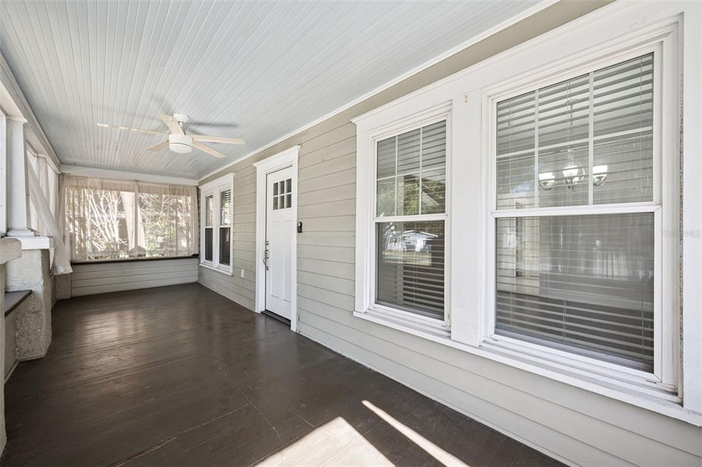 352 Cambridge Boulevard Winter Park, FL 32789 - Photo 9 of 35 a view of wooden floor and windows in an empty room