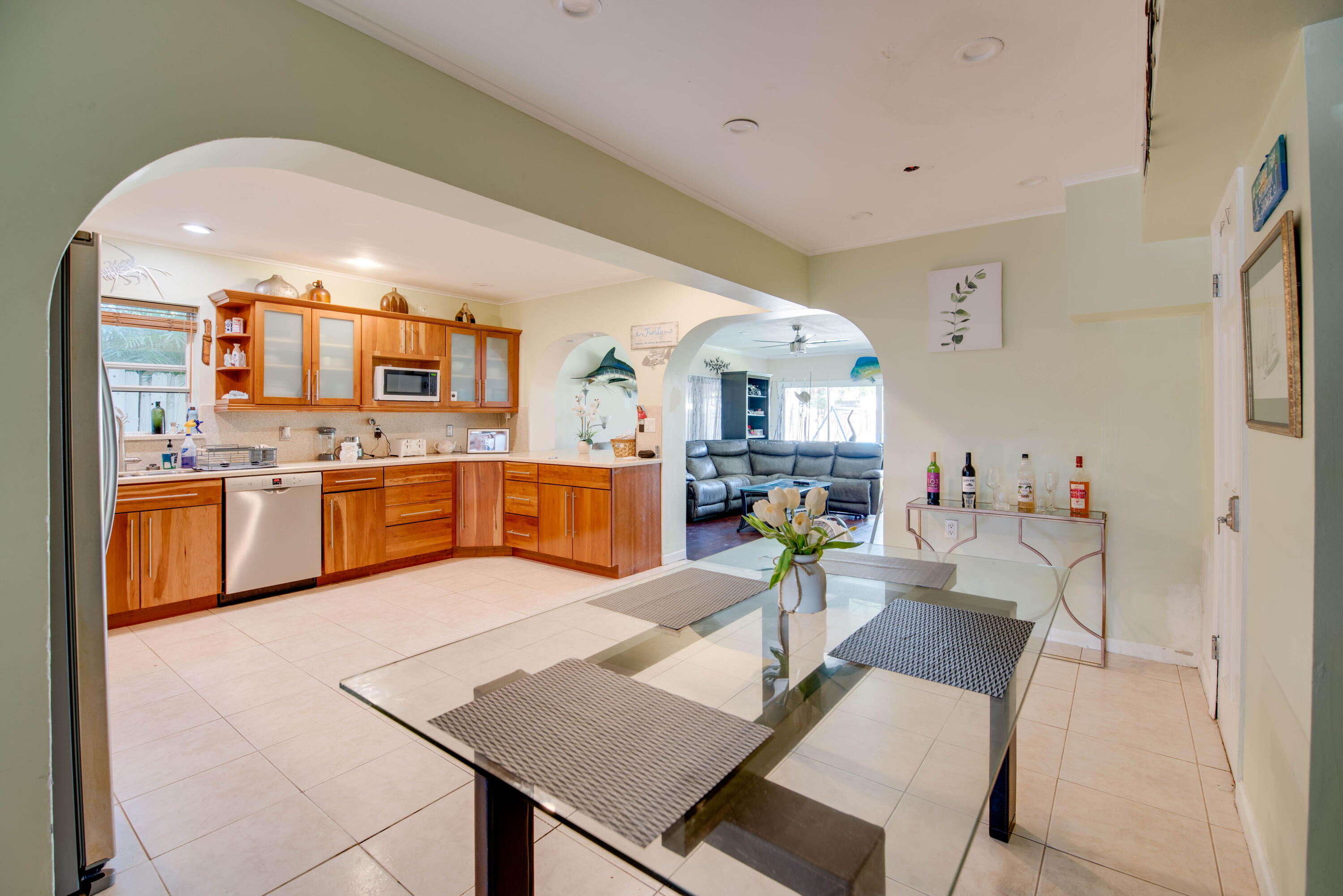 3341 Riviera Drive Key West, FL 33040 - Photo 11 of 33 a living room with stainless steel appliances furniture and a kitchen view