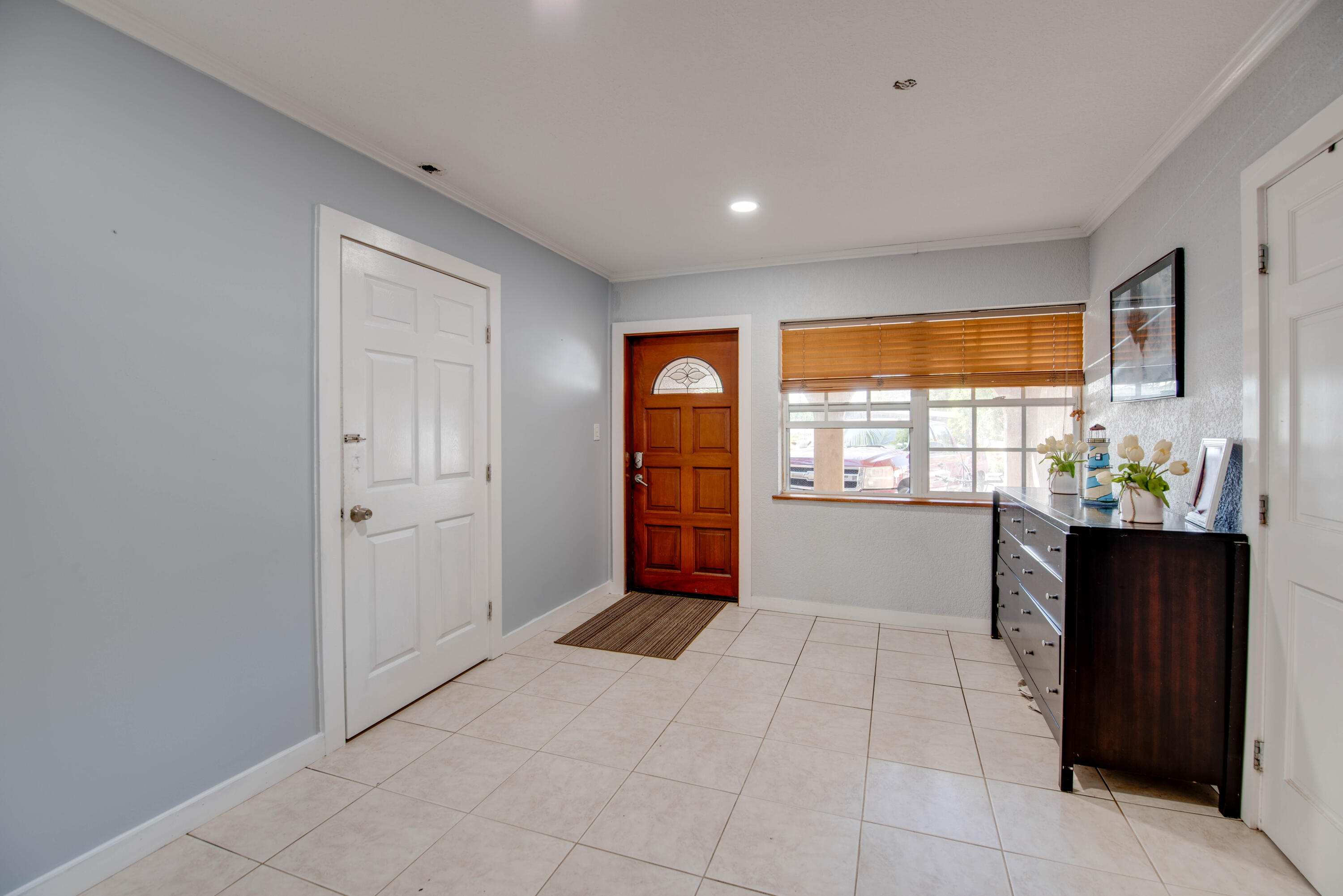 3341 Riviera Drive Key West, FL 33040 - Photo 13 of 33 a view of an empty room with window and cabinet