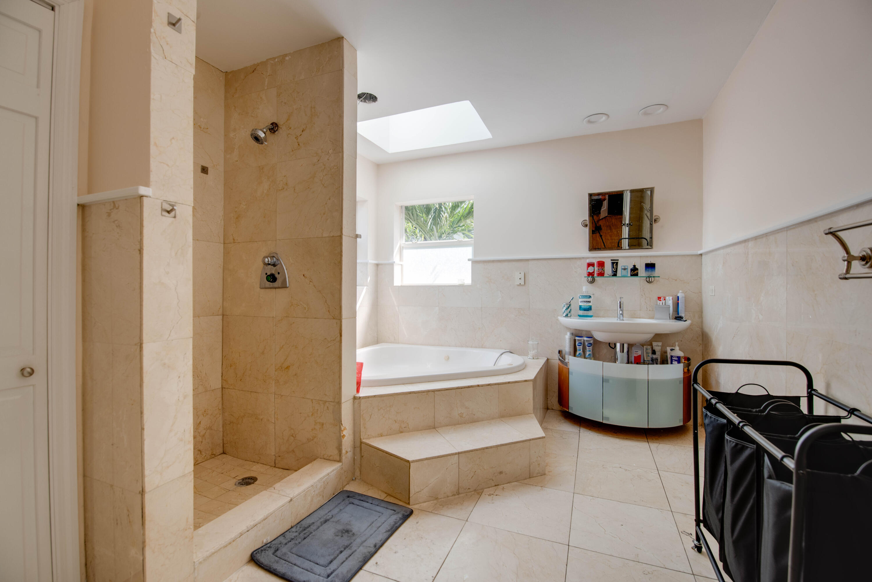 3341 Riviera Drive Key West, FL 33040 - Photo 17 of 33 a bathroom with a bathtub sink and a shower