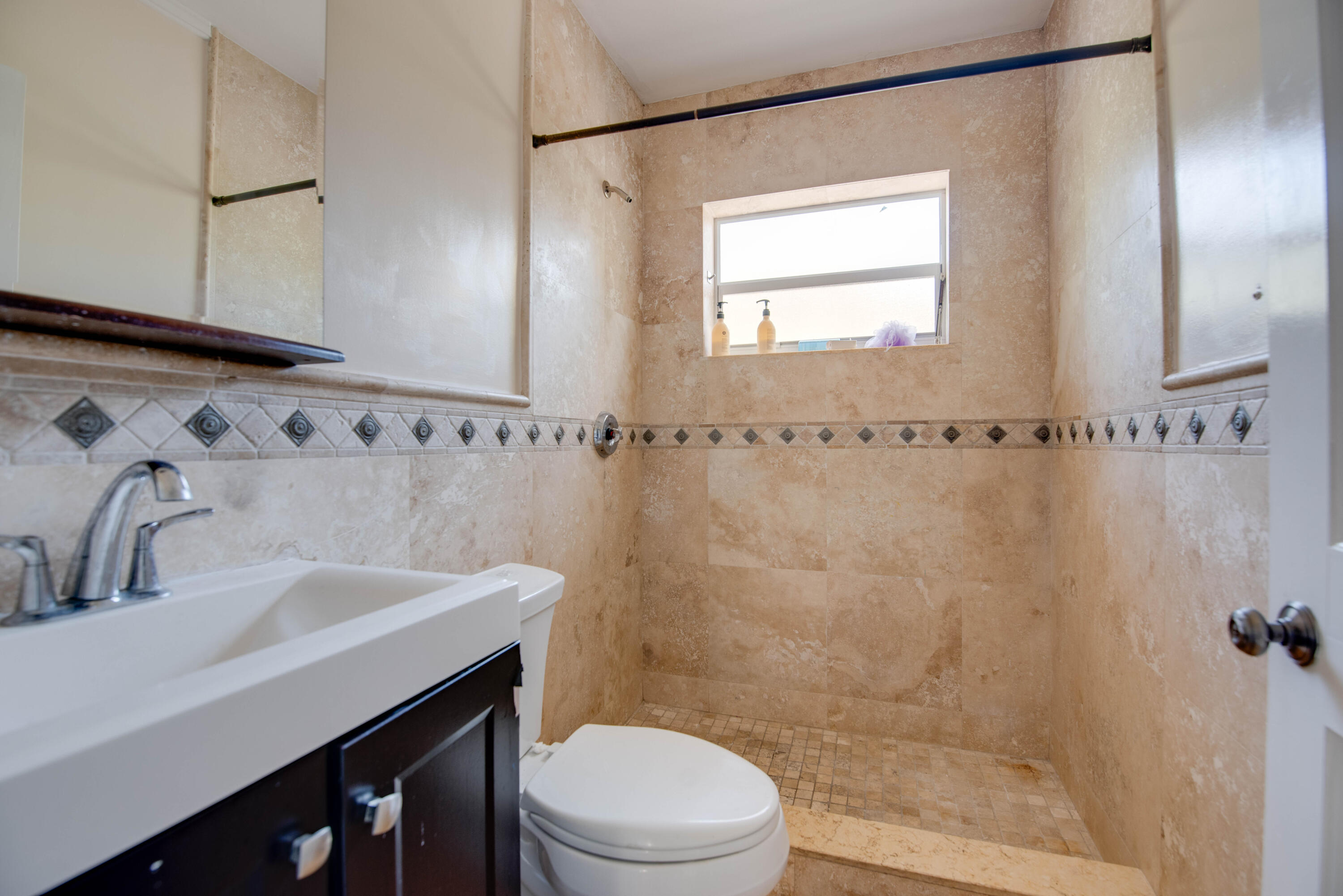 3341 Riviera Drive Key West, FL 33040 - Photo 20 of 33 a bathroom with a sink a toilet and shower