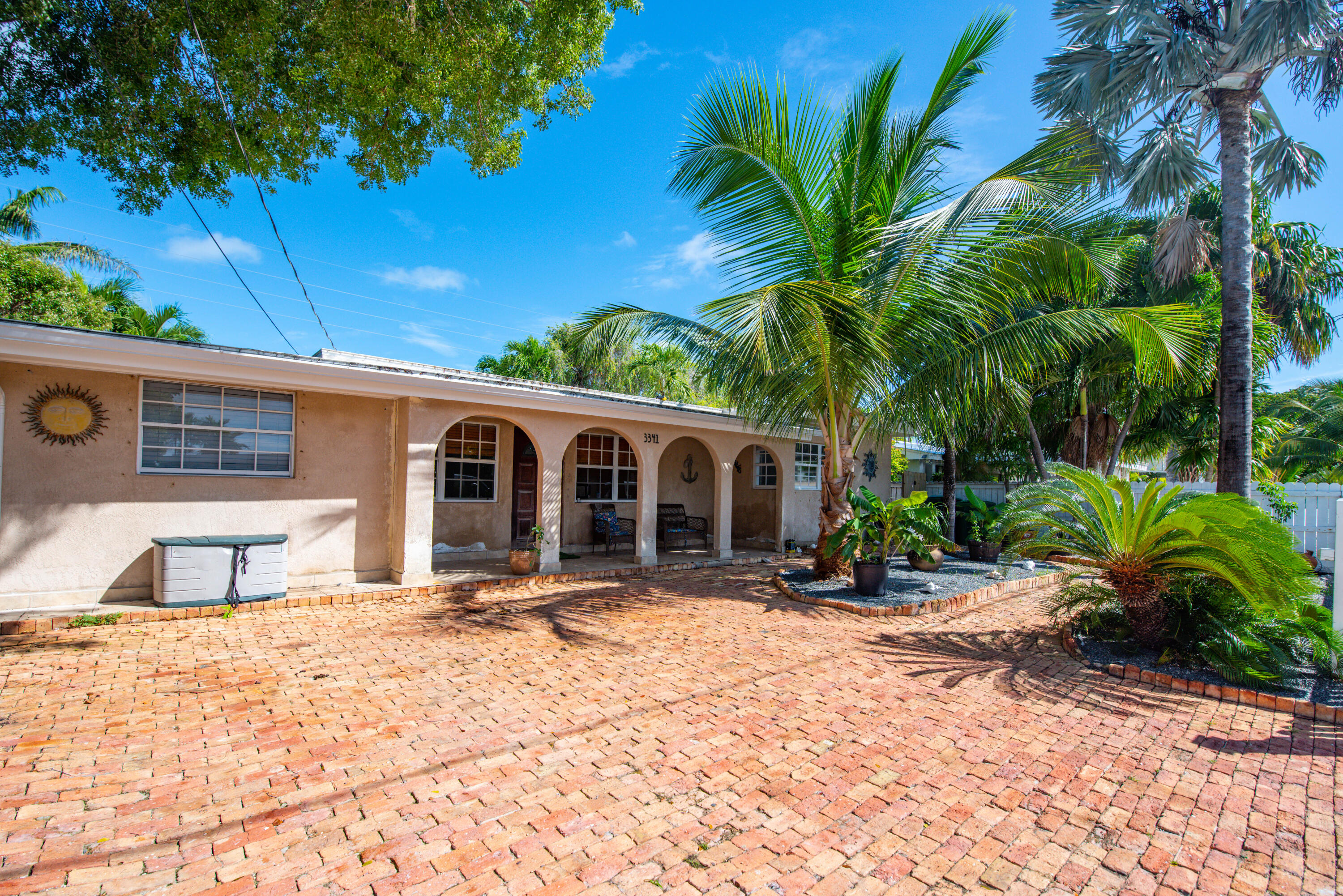 3341 Riviera Drive Key West, FL 33040 - Photo 2 of 33 a front view of house with yard outdoor seating and barbeque oven