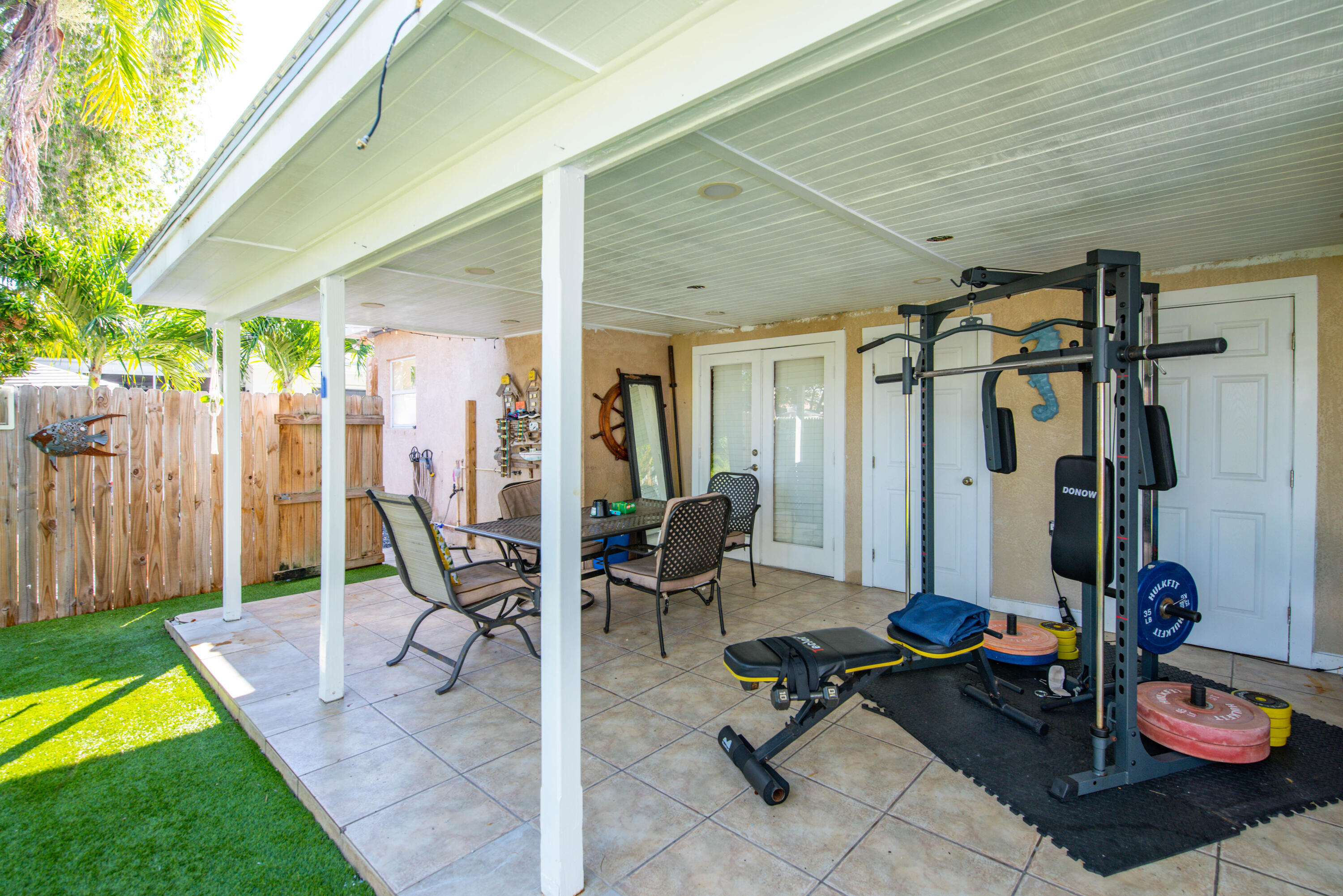 3341 Riviera Drive Key West, FL 33040 - Photo 23 of 33 a view of a patio with table and chairs and potted plants