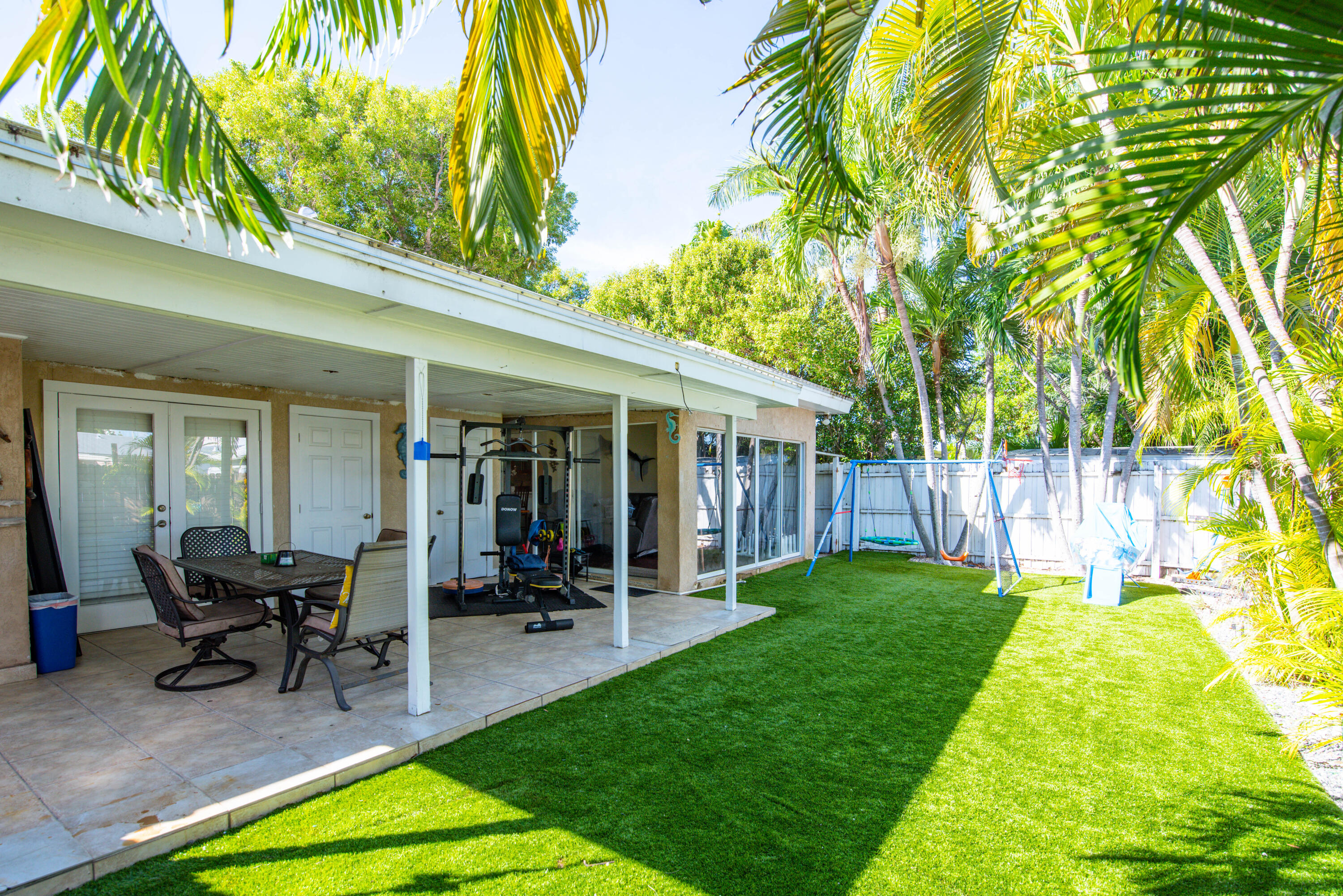 3341 Riviera Drive Key West, FL 33040 - Photo 24 of 33 a view of a house with backyard porch and sitting area