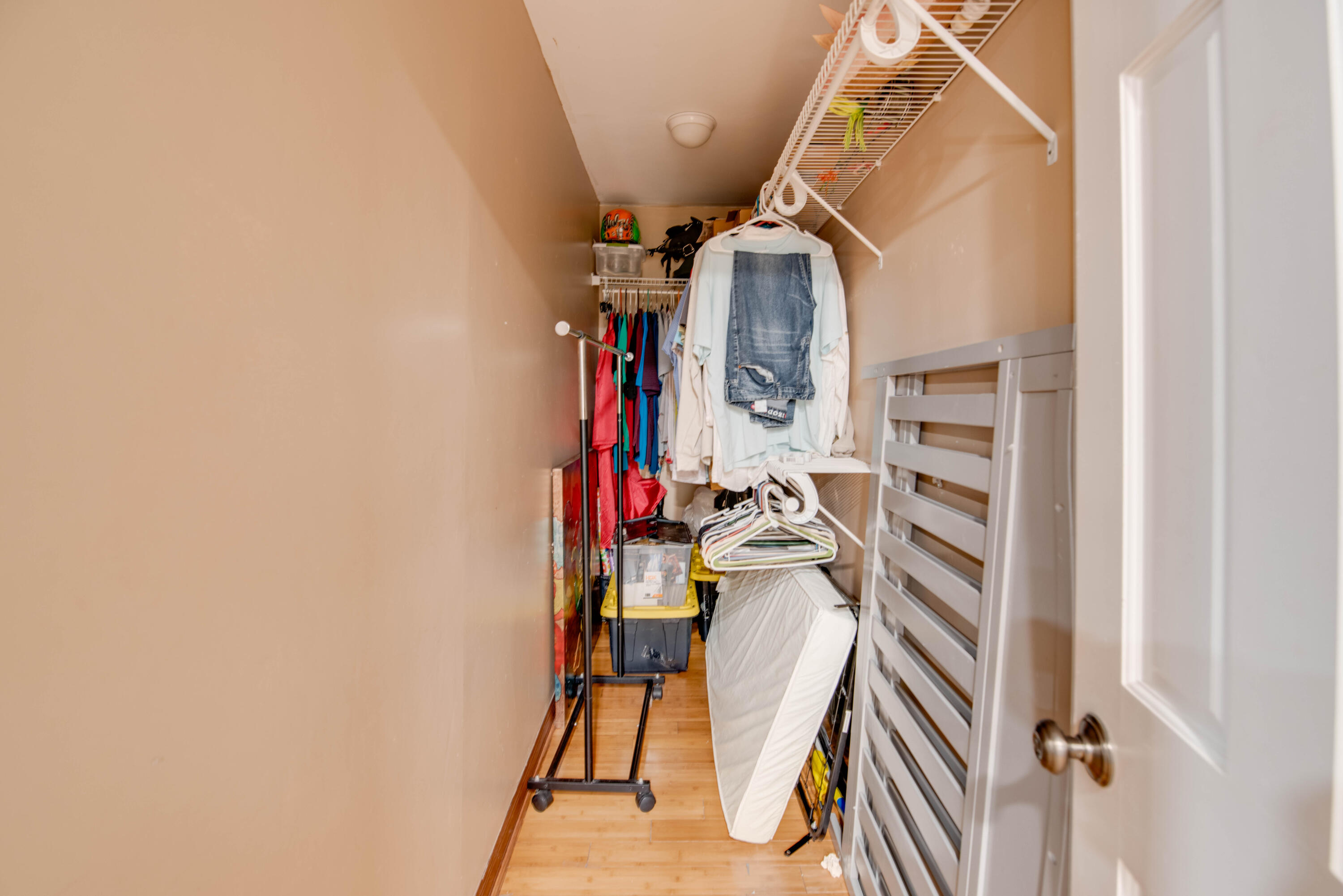 3341 Riviera Drive Key West, FL 33040 - Photo 28 of 33 a view of walk in closet with clothes and shoes
