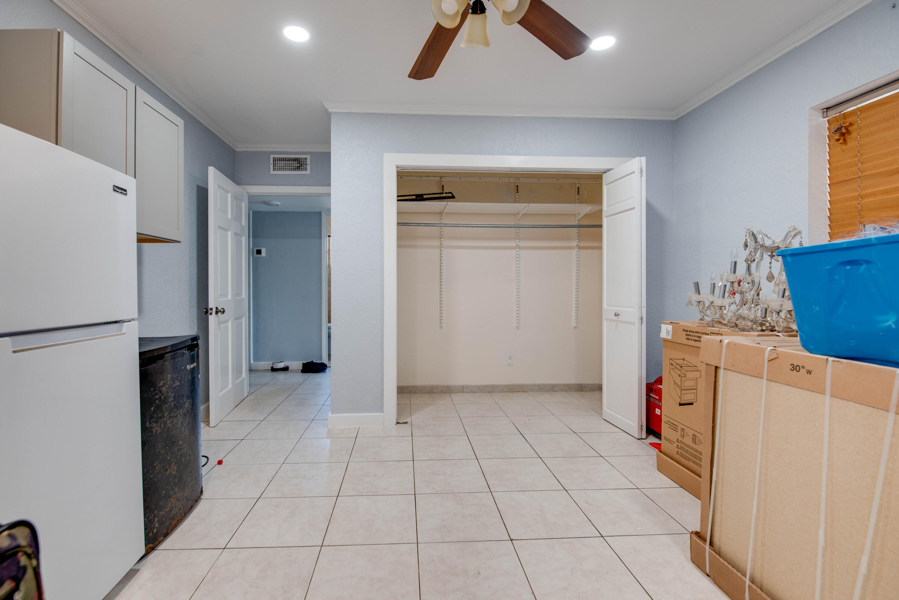 3341 Riviera Drive Key West, FL 33040 - Photo 29 of 33 a view of a storage & utility room with a fridge