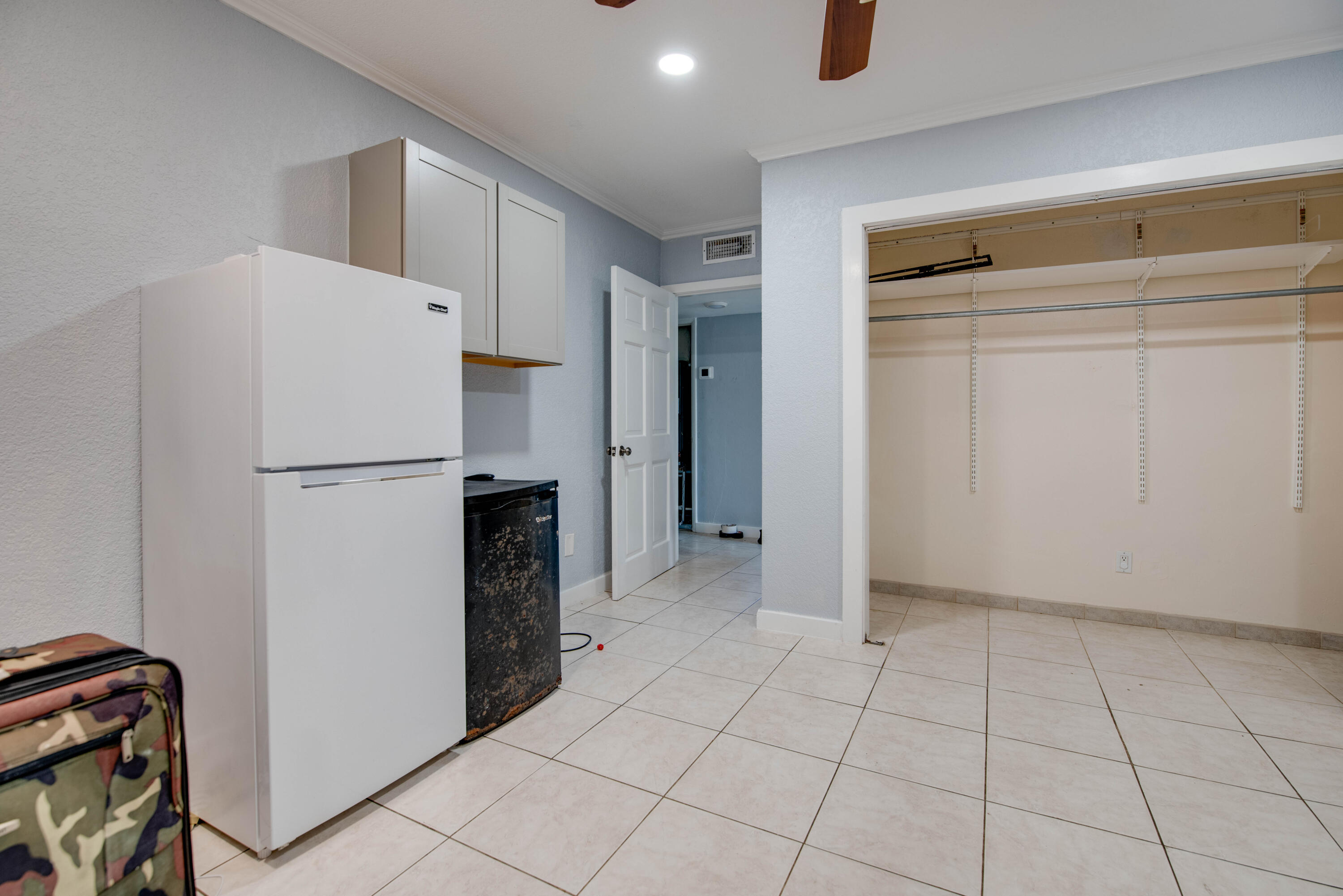 3341 Riviera Drive Key West, FL 33040 - Photo 30 of 33 a view of a kitchen with refrigerator and cabinets