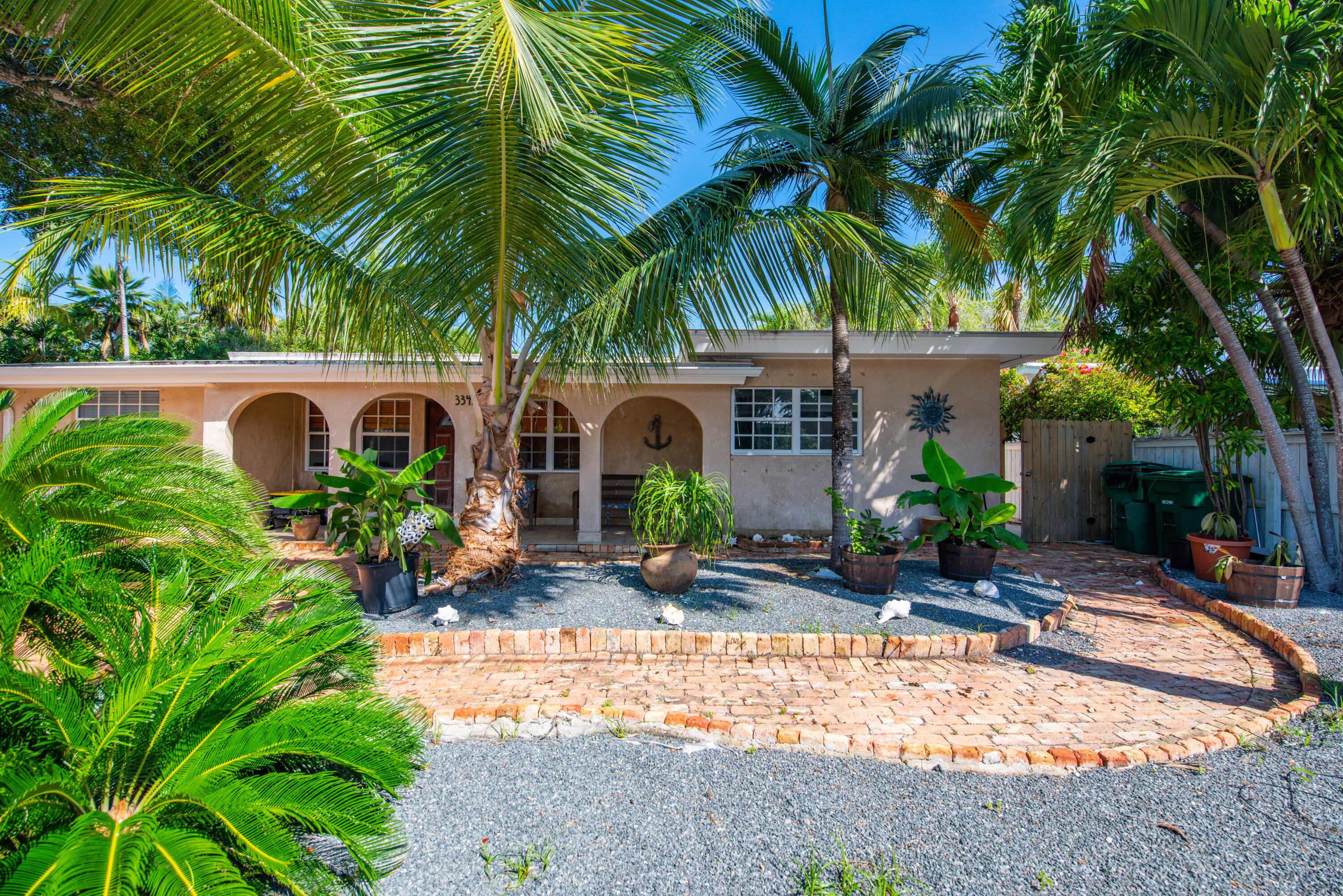 3341 Riviera Drive Key West, FL 33040 - Photo 4 of 33 a couple of palm trees in front of house