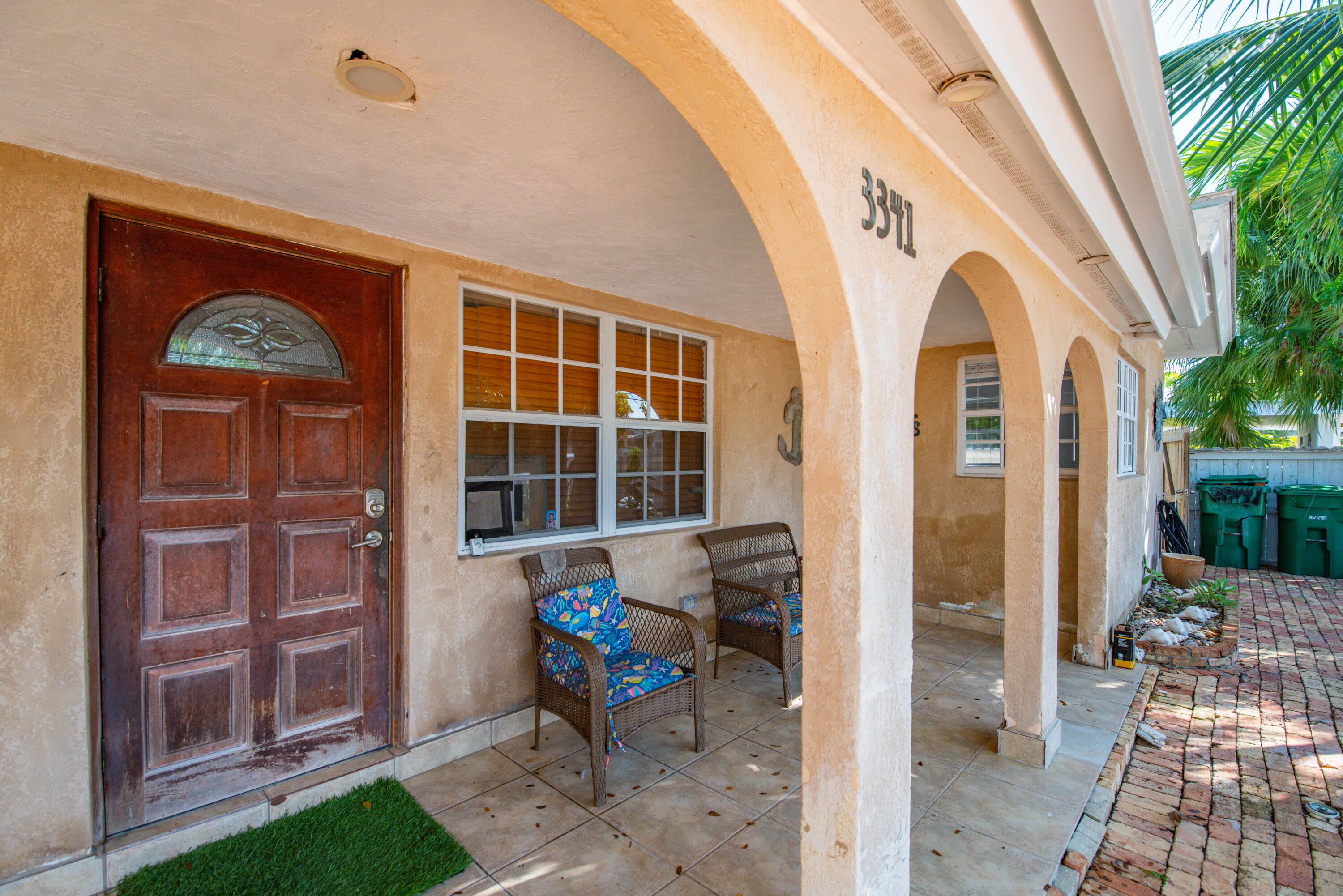 3341 Riviera Drive Key West, FL 33040 - Photo 6 of 33 a view of house with patio outdoor dining space and glass windows