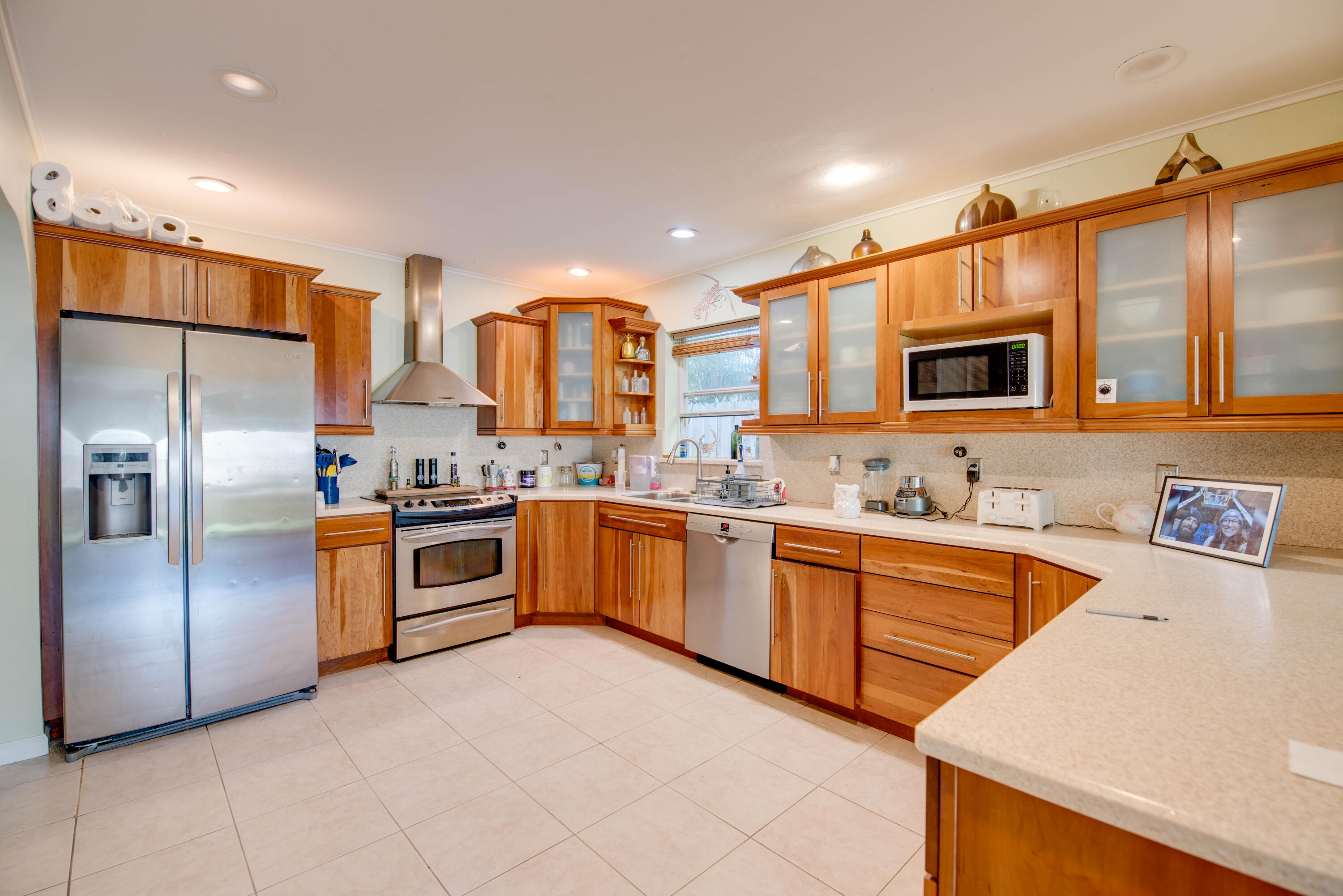 3341 Riviera Drive Key West, FL 33040 - Photo 9 of 33 a large kitchen with stainless steel appliances lots of counter space and a sink