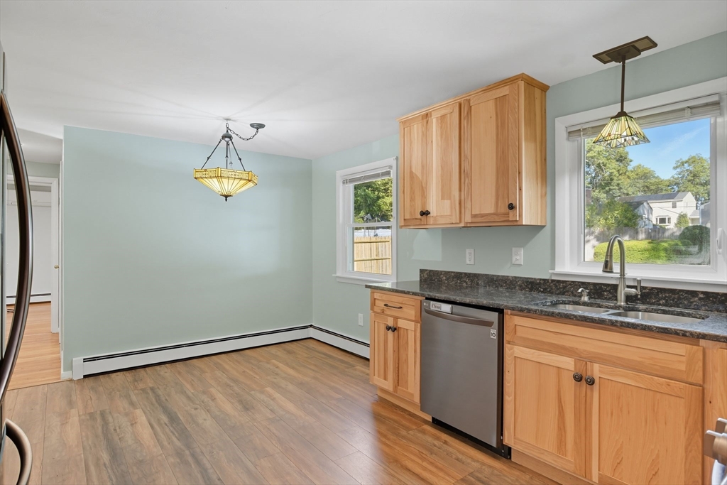 22 Colorado Street Springfield, MA 01118 - Photo 11 of 39 a kitchen with a sink window and cabinets