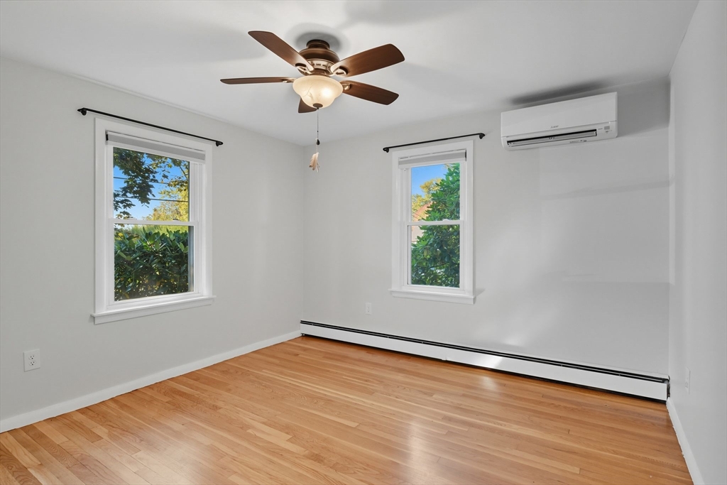 22 Colorado Street Springfield, MA 01118 - Photo 12 of 39 a view of an empty room with wooden floor and a window