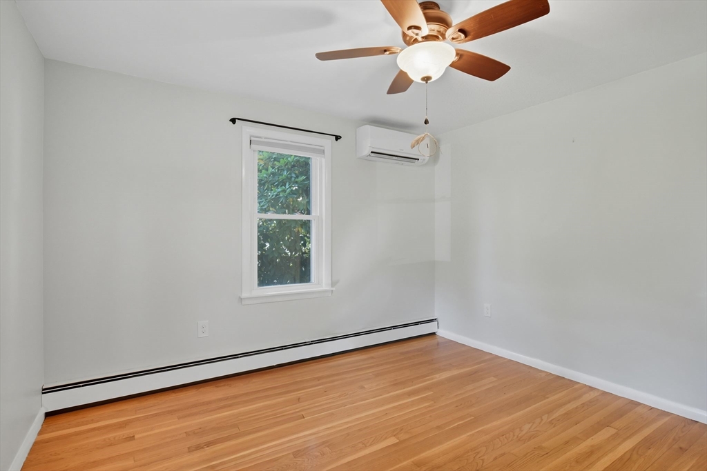 22 Colorado Street Springfield, MA 01118 - Photo 13 of 39 an empty room with a window and a ceiling fan