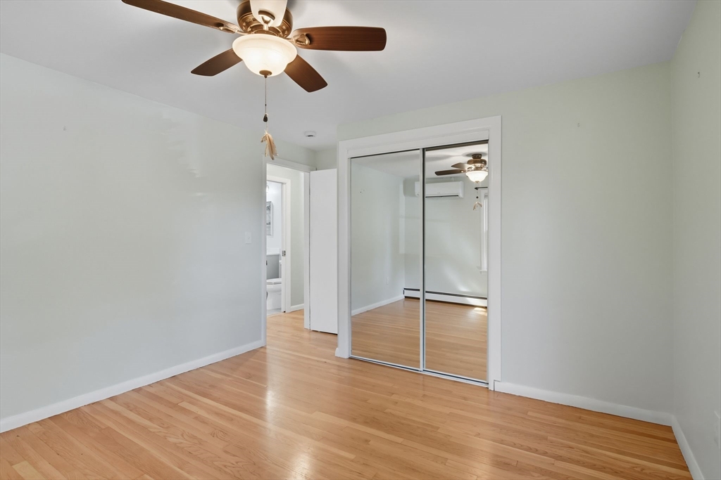 22 Colorado Street Springfield, MA 01118 - Photo 14 of 39 a view of empty room with wooden floor and fan