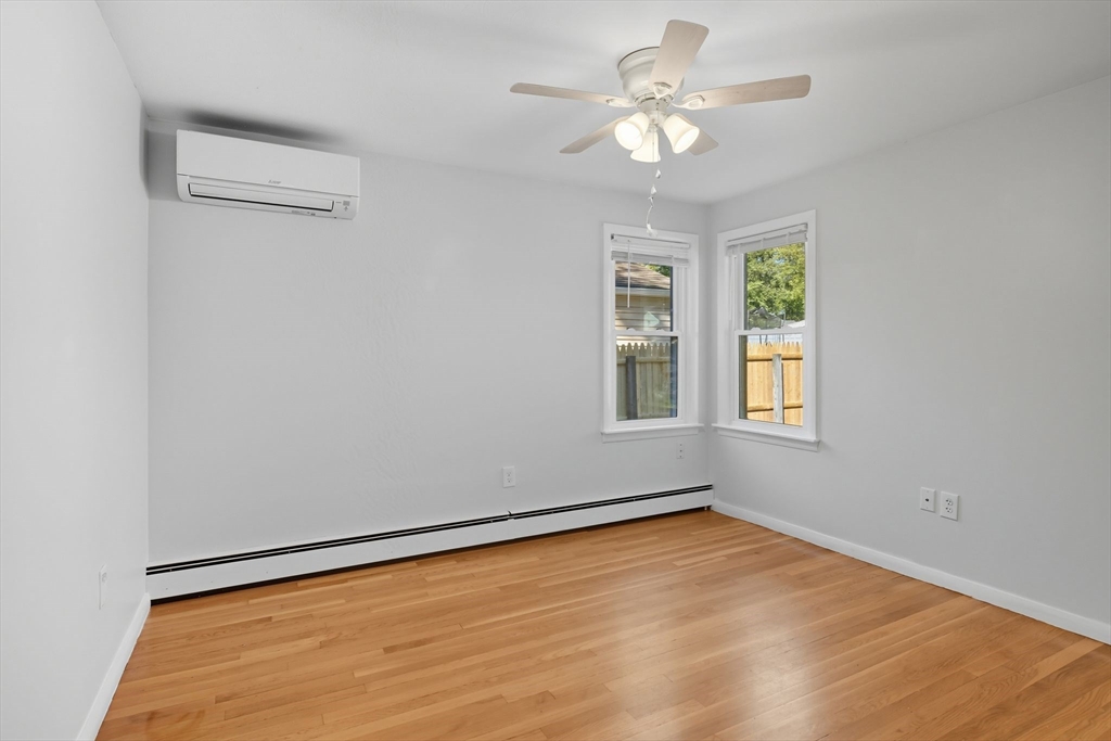 22 Colorado Street Springfield, MA 01118 - Photo 15 of 39 an empty room with windows and fan