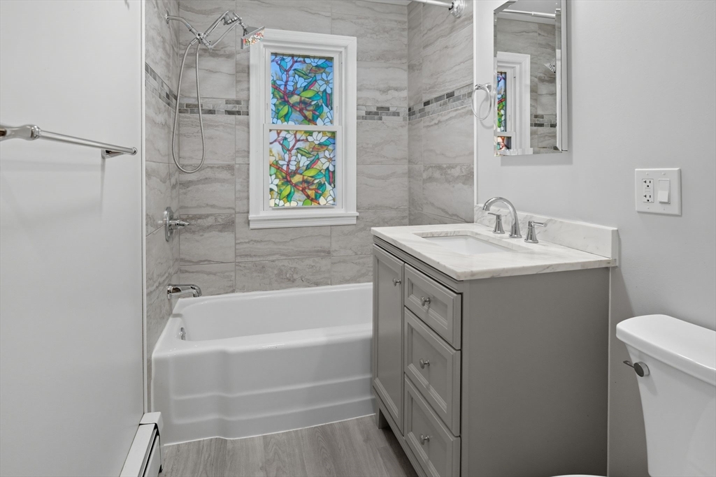 22 Colorado Street Springfield, MA 01118 - Photo 17 of 39 a bathroom with a sink and a bathtub