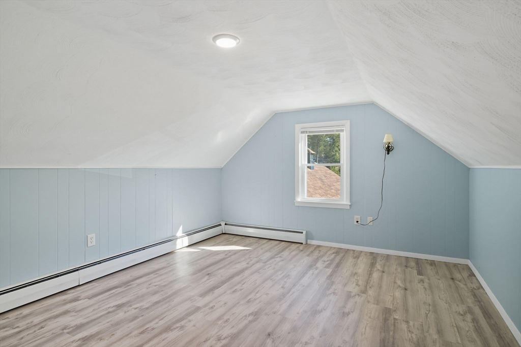 22 Colorado Street Springfield, MA 01118 - Photo 22 of 39 an empty room with wooden floor and windows