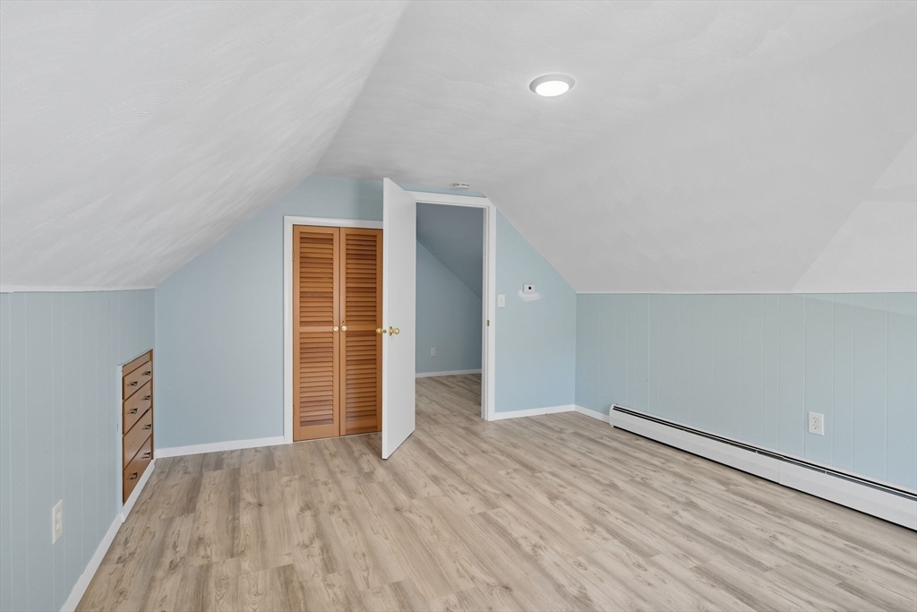 22 Colorado Street Springfield, MA 01118 - Photo 23 of 39 an empty room with wooden floor and windows