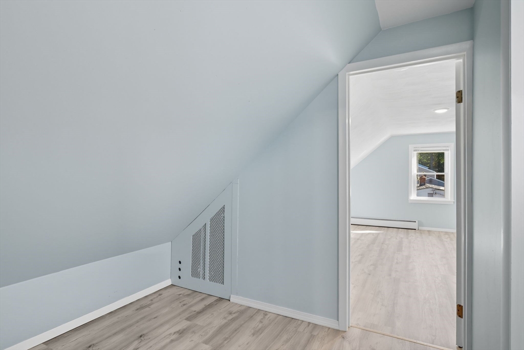 22 Colorado Street Springfield, MA 01118 - Photo 25 of 39 an empty room with wooden floor and windows