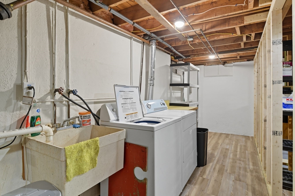 22 Colorado Street Springfield, MA 01118 - Photo 31 of 39 a view of a kitchen with a sink and a refrigerator