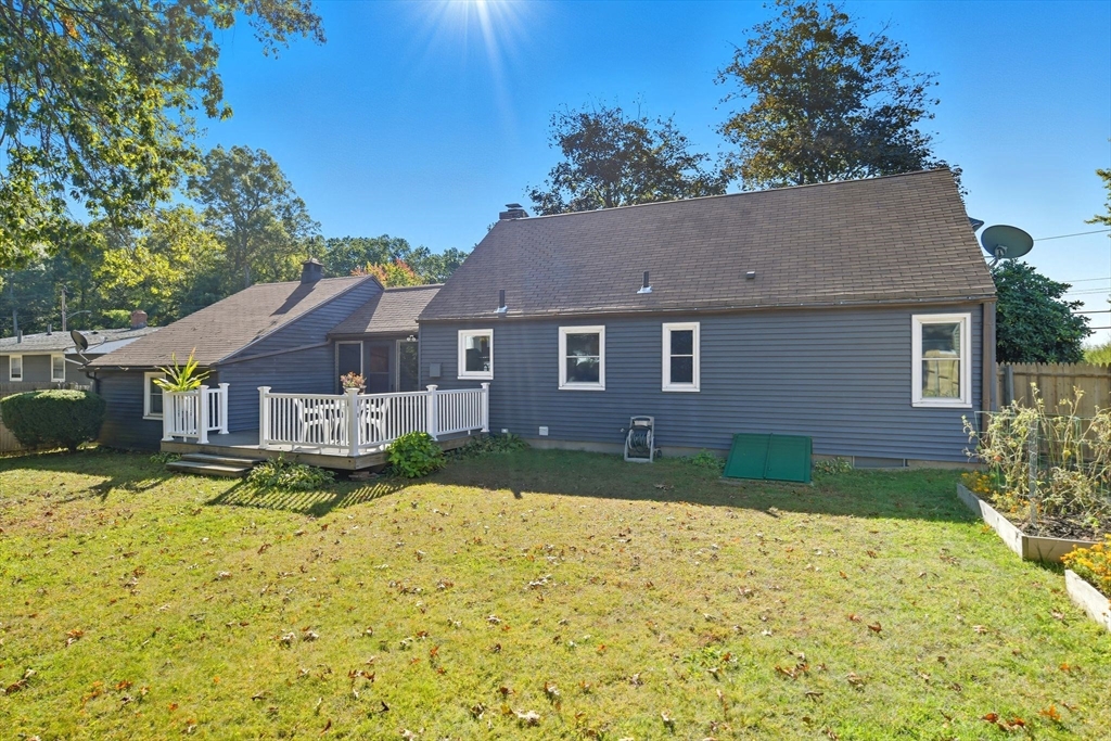 22 Colorado Street Springfield, MA 01118 - Photo 37 of 39 a view of a yard in front of a house with a large tree