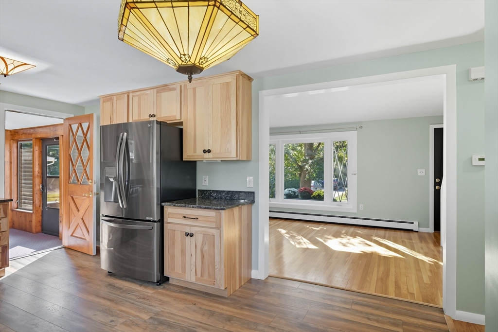 22 Colorado Street Springfield, MA 01118 - Photo 10 of 39 a kitchen with granite countertop a refrigerator a sink and a stove top oven