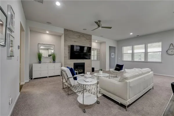 a living room with furniture and a fireplace