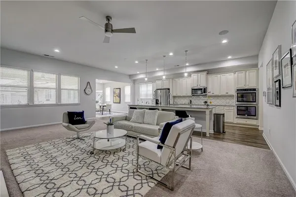 a living room with furniture and a large window