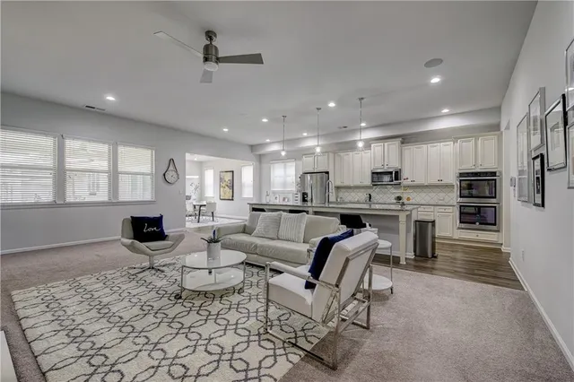 a living room with furniture and a large window