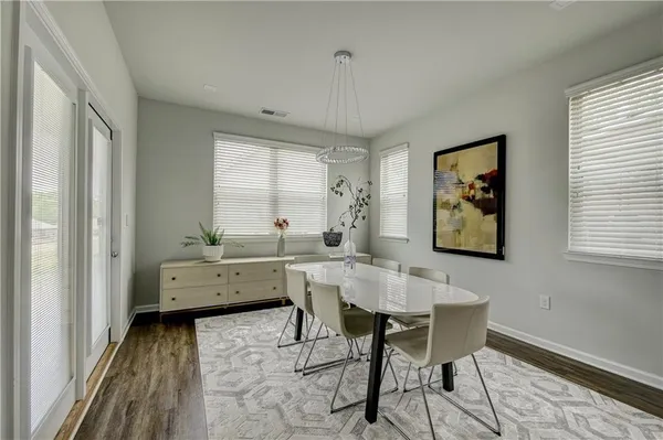 a view of a workspace with furniture and window