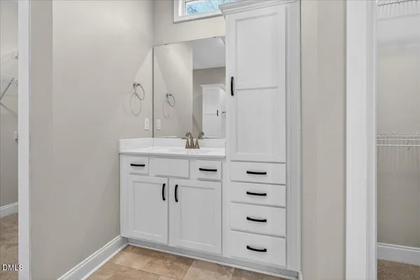 a bathroom with a glass shower door