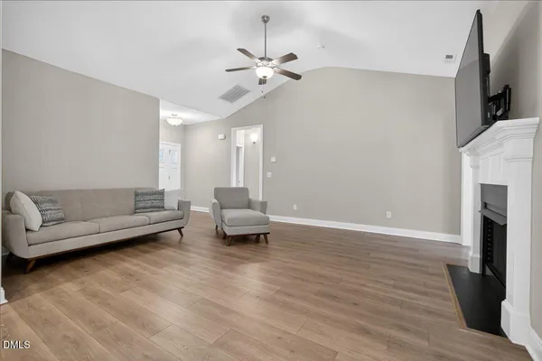 a kitchen with stainless steel appliances granite countertop a refrigerator a sink a stove a microwave and cabinets
