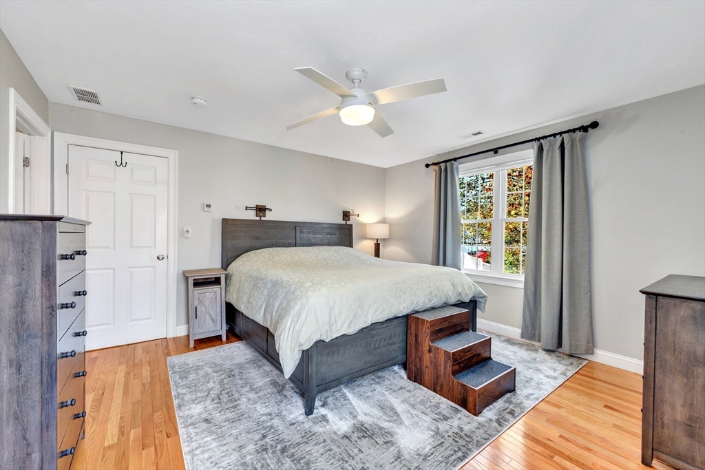 24 River Point Drive, Unit 6 Ipswich, MA 01938 - Photo 13 of 27 a bedroom with a bed and a window