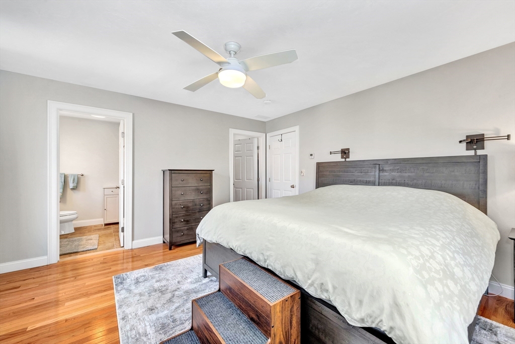 24 River Point Drive, Unit 6 Ipswich, MA 01938 - Photo 15 of 27 a spacious bedroom with a bed and wooden floor