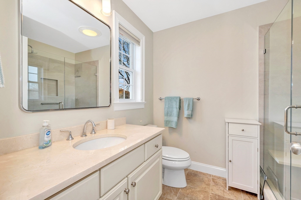 24 River Point Drive, Unit 6 Ipswich, MA 01938 - Photo 16 of 27 a bathroom with a granite countertop sink mirror and a toilet