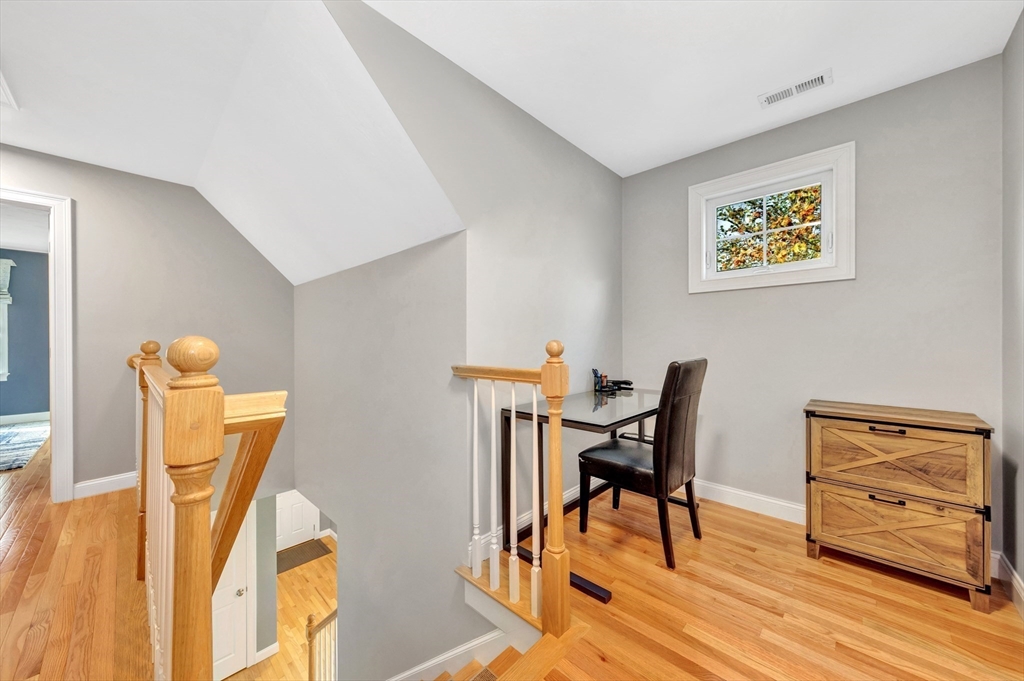 24 River Point Drive, Unit 6 Ipswich, MA 01938 - Photo 17 of 27 a view of a dining room with furniture and wooden floor