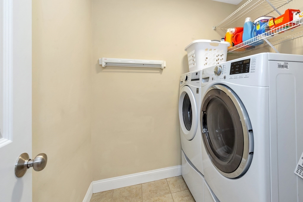 24 River Point Drive, Unit 6 Ipswich, MA 01938 - Photo 18 of 27 a utility room with dryer and washer