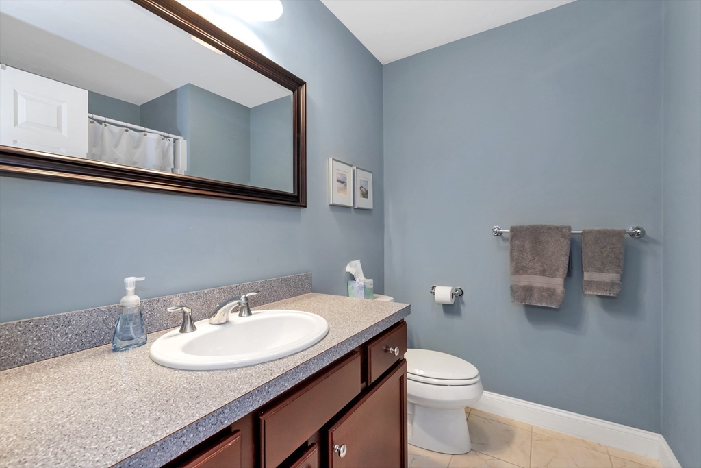 24 River Point Drive, Unit 6 Ipswich, MA 01938 - Photo 19 of 27 a bathroom with a sink and a toilet