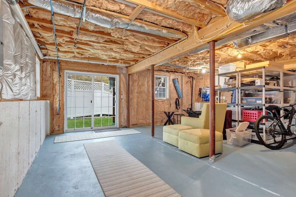 24 River Point Drive, Unit 6 Ipswich, MA 01938 - Photo 23 of 27 a view of a porch with furniture and a garage