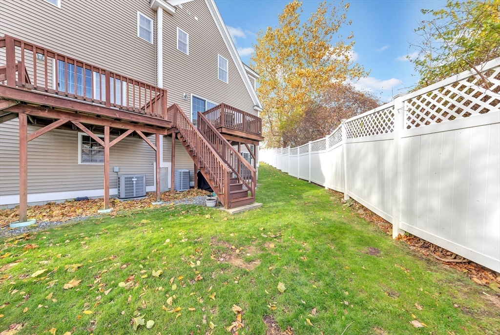24 River Point Drive, Unit 6 Ipswich, MA 01938 - Photo 24 of 27 a view of a house with a yard