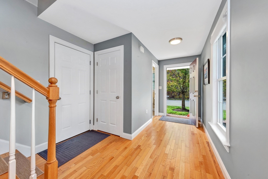 24 River Point Drive, Unit 6 Ipswich, MA 01938 - Photo 3 of 27 a view of a room with wooden floor and balcony