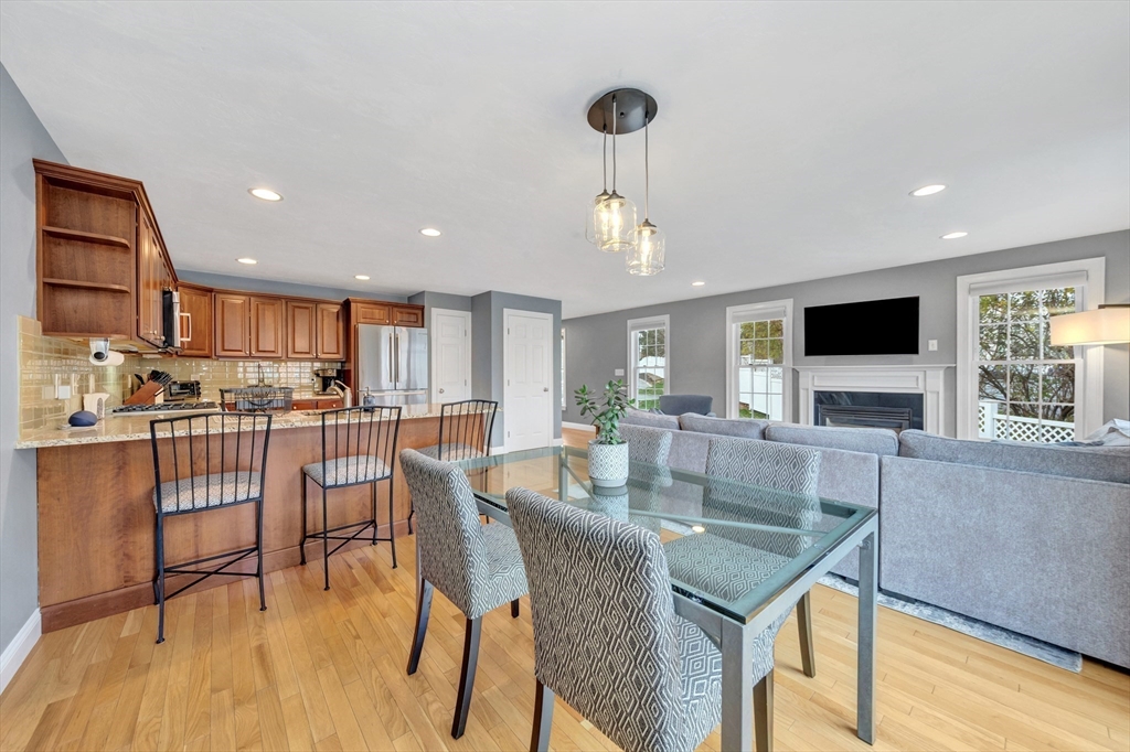 24 River Point Drive, Unit 6 Ipswich, MA 01938 - Photo 9 of 27 a dining room with furniture and a flat screen tv